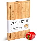 Coninx Schneidebrett Holz groß mit Saftrille - Antibakterielles Moso Bambus Holzbrett zum Schneiden von Gemüse, Obst, Käse, Fleisch & mehr - Robustes Holz Küchenbrett - Servierbrett